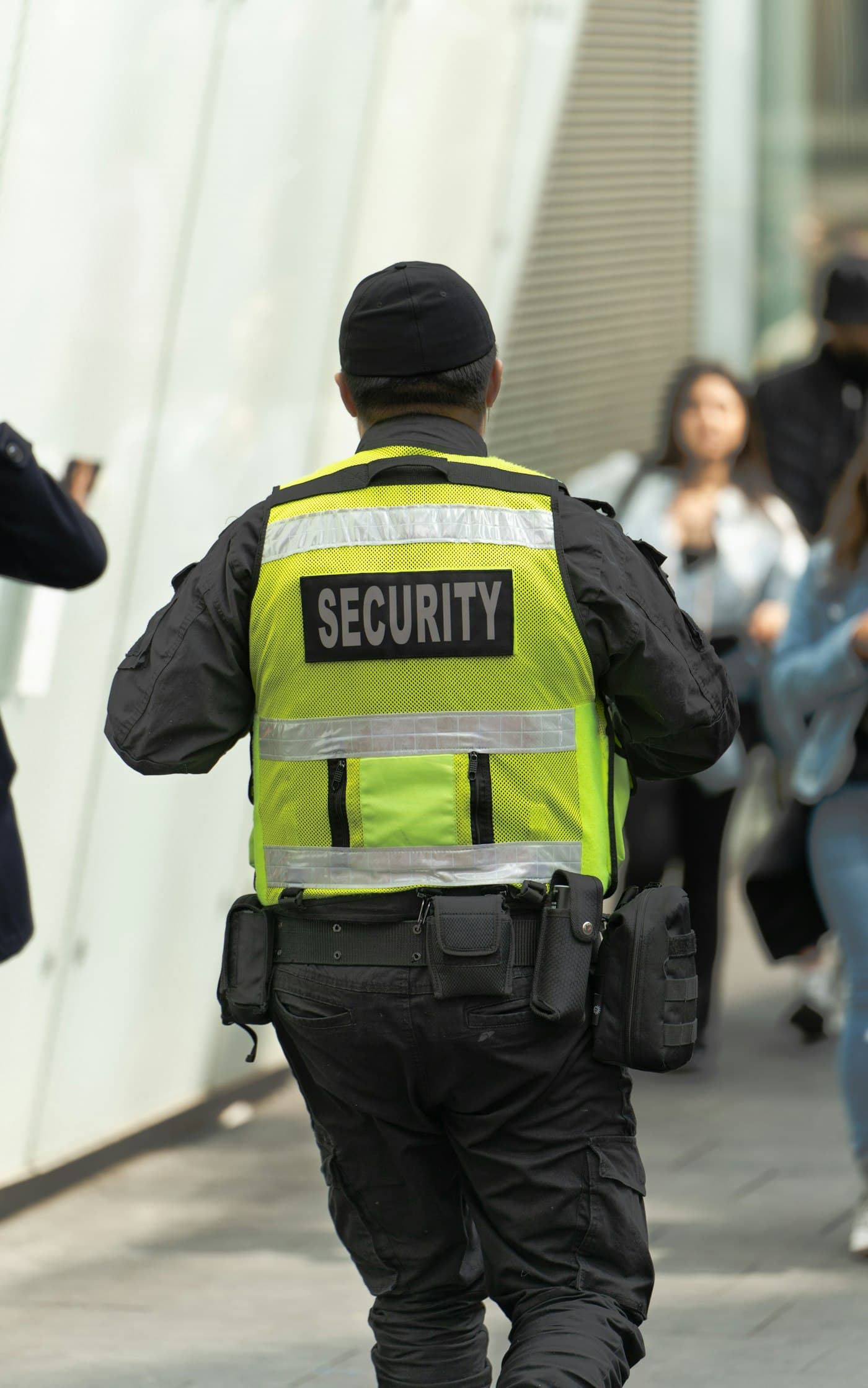 Security guard wearing a hi-vis SECURITY vest